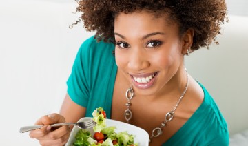 Close-up Of Beautiful African American Woman Eating Salad